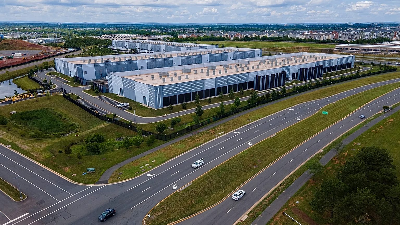 Cars drive past data centres in Virginia, July 16, 2023.