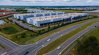 Cars drive past data centres in Virginia, July 16, 2023.