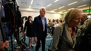 Senator John Cornyn leaves an election night event in Austin, Texas after losing the Republican Party's Senate nomination.