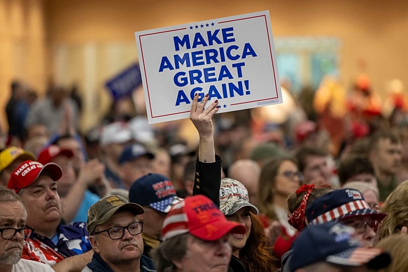 A Trump supporter holds up a MAGA sign during a rally for Donald Trump, in Green Bay, Wis., April 2, 2024. (AP Photo/Mike Roemer, File)