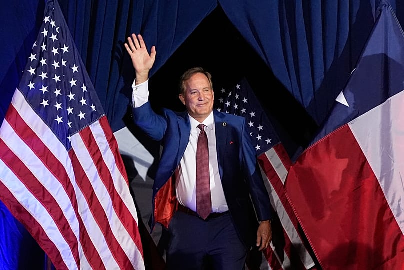 Texas Attorney General Ken Paxton waves as he takes the stage during an election night event after winning his party's nomination, May 26, (AP Photo/Tony Gutierrez)