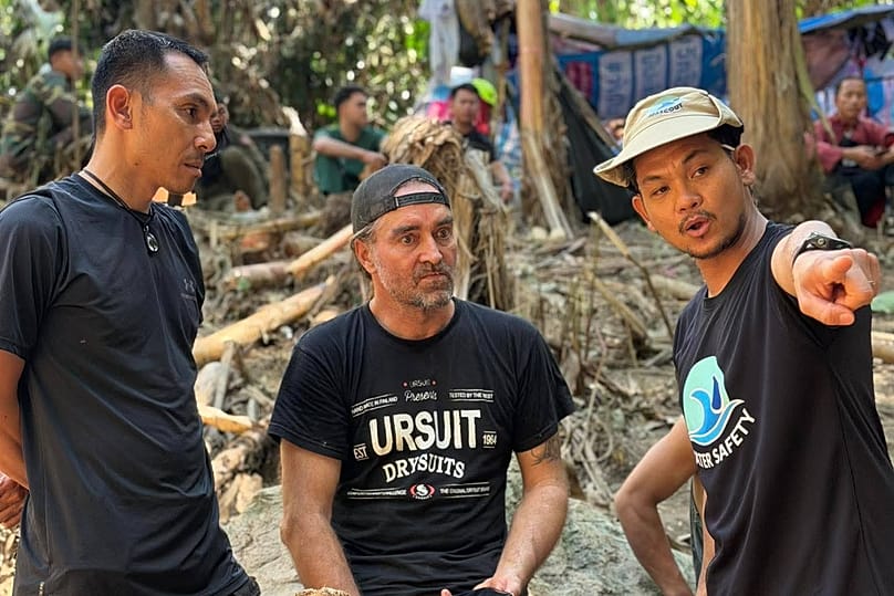 Rescuers try to reach people who have been trapped in a cave in Xaisomboun province, 26 May, 2026