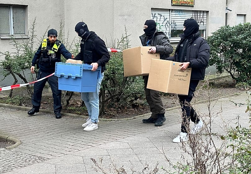 Investigators enter the home of former RAF member Daniela Klette with boxes and cartons in Berlin, 28 February, 2024