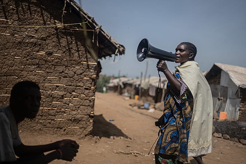 Machozi Naumi, 45, raises awareness of Ebola in the IDP camp on the property of the city's Institut Supérieur Pédagogique, in Bunia, Congo, May 26, 2026