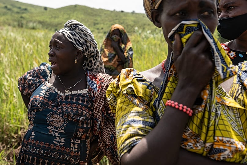 Family members of a victim who died from the Ebola virus mourn during the funeral at Rwampara Cemetery, in Rwampara, Congo, Saturday, May 23, 2026