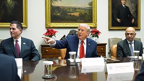 FILE. CEO of Dell, Michael Dell, left, and CEO of IBM, Arvind Krishna, right, as US President Donald Trump speaks during a roundtable at the White House, Dec. 2025