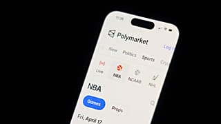 FILE - A phone displays sports trades on Polymarket on Thursday, April 16, 2026, in Portland, Ore. (AP Photo/Jenny Kane)