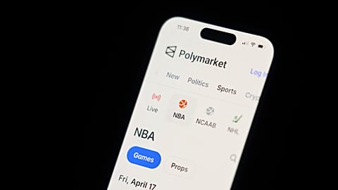 FILE - A phone displays sports trades on Polymarket on Thursday, April 16, 2026, in Portland, Ore. (AP Photo/Jenny Kane)