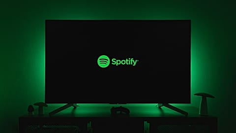 The Spotify logo on a flat-screen TV