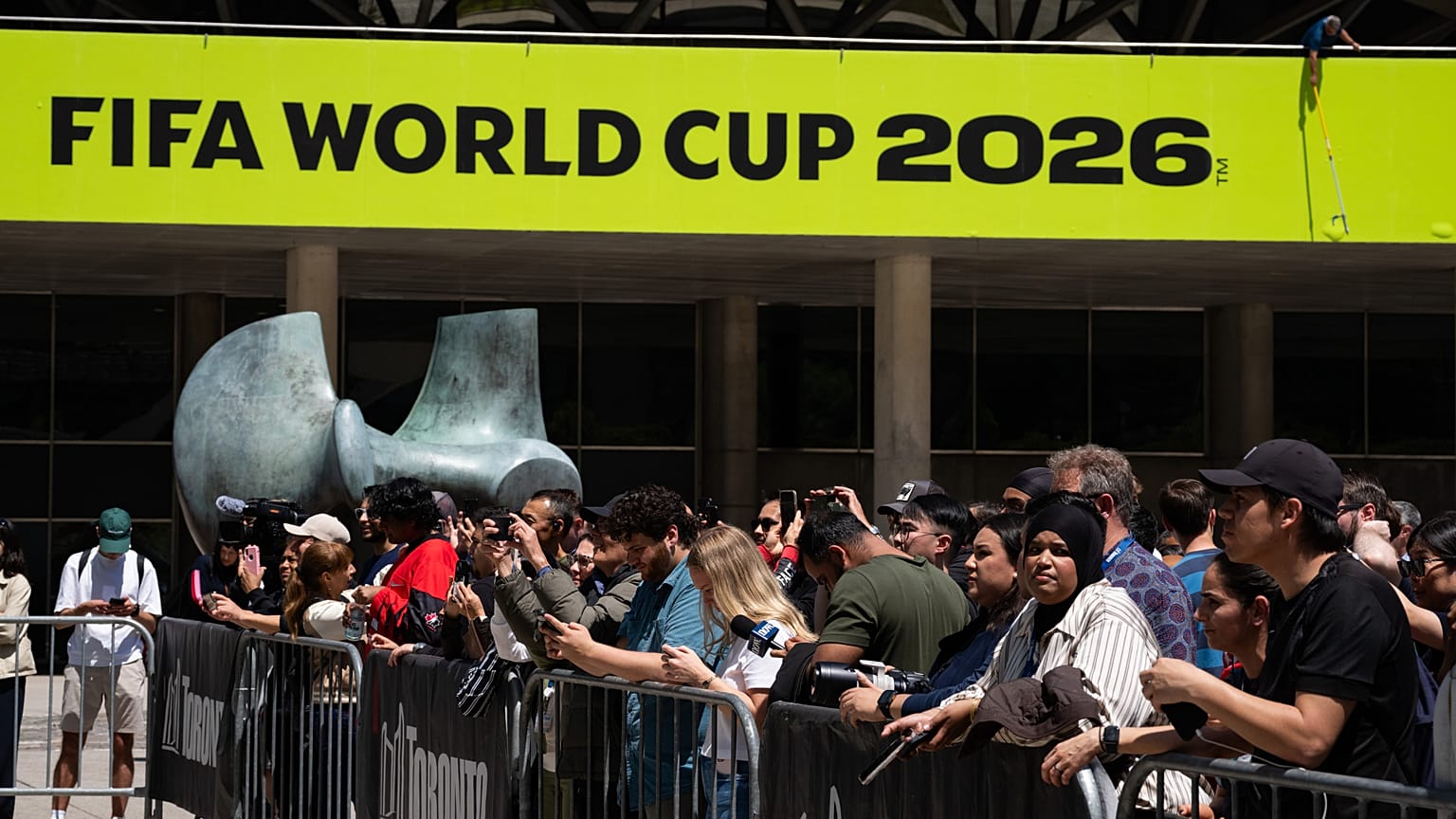 Fans gather for a FIFA World Cup Trophy Tour event at Nathan Phillips Square in Toronto, 25 May 2026