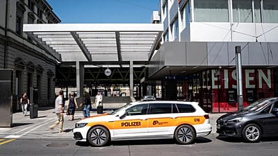 A police vehicle is parked in front of the train station following a stabbing attack in Winterthur, 28 May, 2026