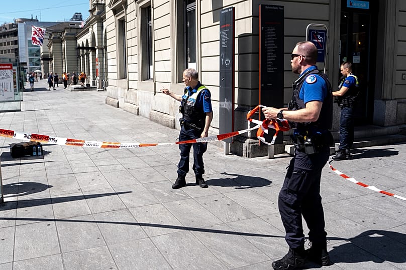 Police officers remove tape following a stabbing attack at the train station in Winterthur, 28 May, 2026