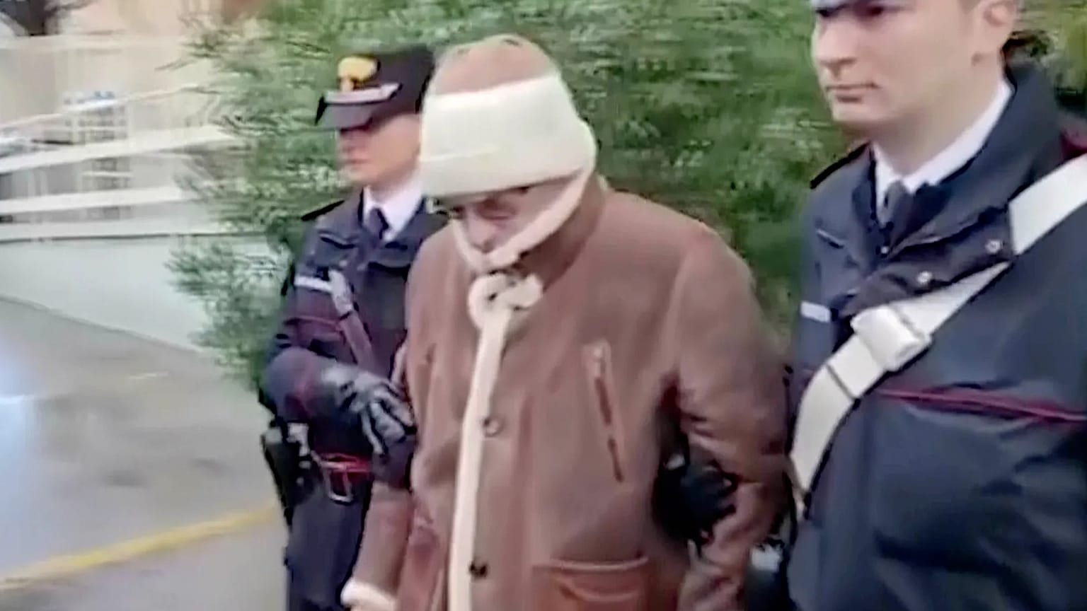 Matteo Messina Denaro being escorted from a Carabinieri police station shortly after his arrest in Palermo, 16 January, 2023
