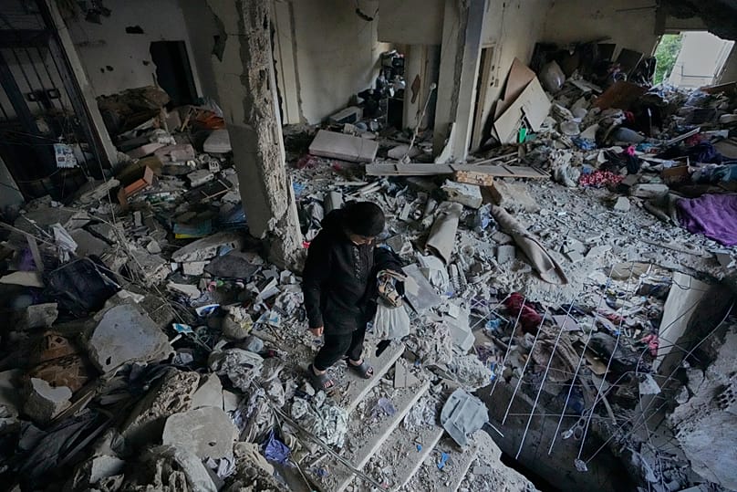A woman checks a destroyed apartment that was hit in an Israeli airstrike in the southern port city of Sidon, Lebanon, Thursday, May 28, 2026.