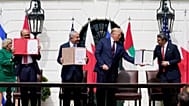 US President Donald Trump stands with Bahraini, Israeli and Emirati officials during the signing ceremony of the Abraham Accords at the White House in Washington on Septembe