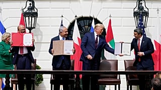US President Donald Trump stands with Bahraini, Israeli and Emirati officials during the signing ceremony of the Abraham Accords at the White House in Washington on Septembe