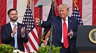 FILE: US President Donald Trump points as Vice President JD Vance watches at the Memorial Amphitheater in Arlington National Cemetery, 25 May 2026