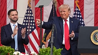 FILE: US President Donald Trump points as Vice President JD Vance watches at the Memorial Amphitheater in Arlington National Cemetery, 25 May 2026