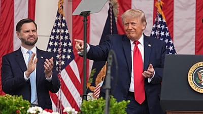 FILE: US President Donald Trump points as Vice President JD Vance watches at the Memorial Amphitheater in Arlington National Cemetery, 25 May 2026