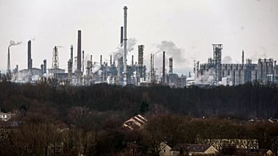 A chemical industrial park is seen behind residential buildings, in Gelsenkirchen, Germany, Wednesday, Feb. 12, 2025.