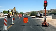Two automated safety lights have replaced construction zone flaggers directing traffic at this road project, Tuesday, 21 April, 2026, in Phoenix.