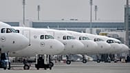 Lufthansa aircraft are parked at an airport as Lufthansa pilots are on a two-day strike in Munich, Germany, Monday, April 13, 2026.