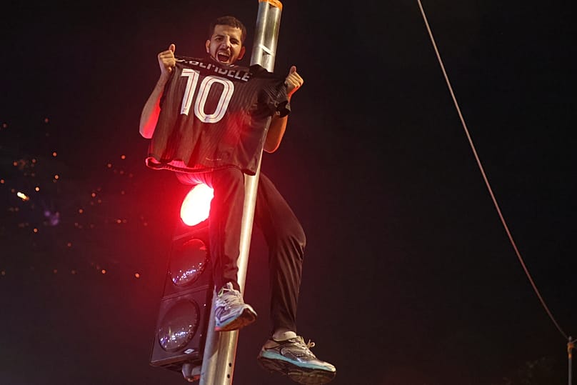 PSG supporters celebrate in Paris, Saturday, May 30, 2026 after the Champions League final soccer match between Paris Saint-Germain and Arsenal that was played in Budapest, PS