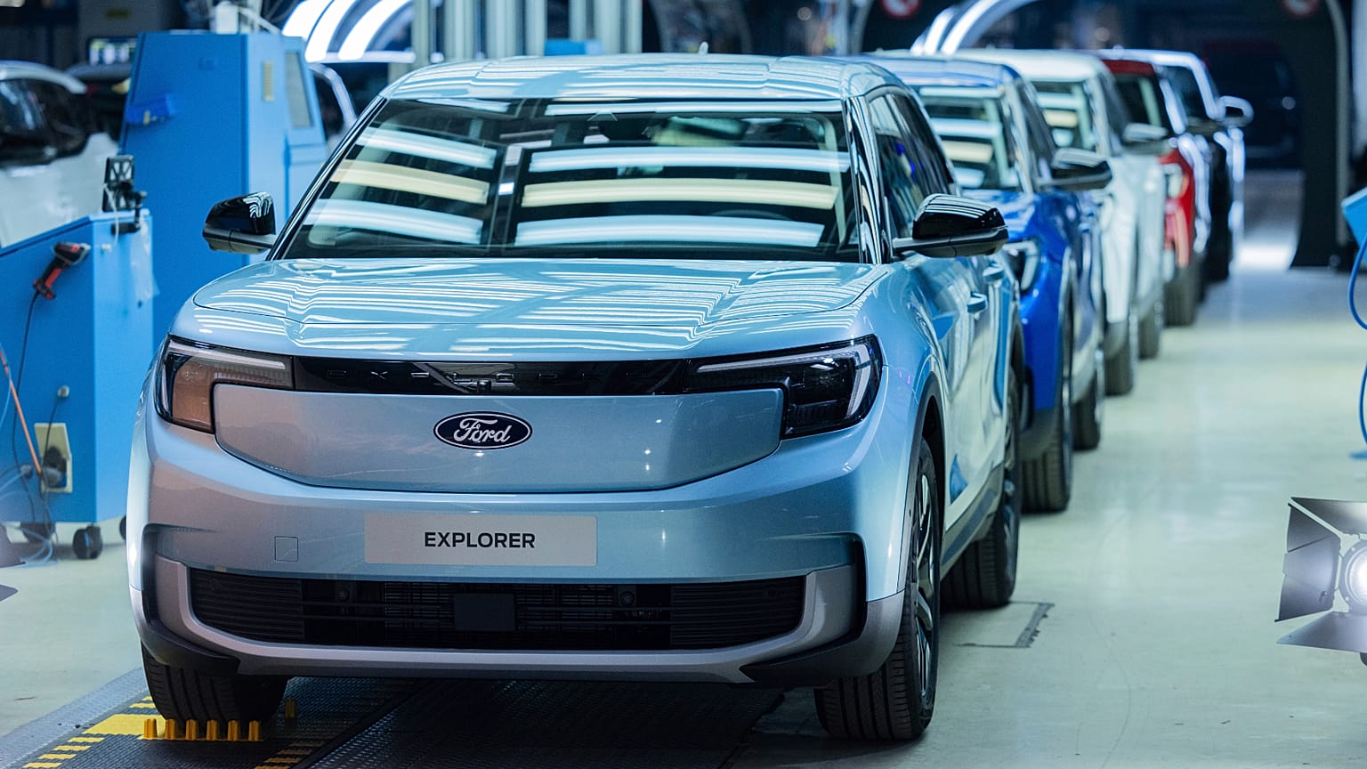 Ford Explorer electric cars stand in the hall at the start of production, in Cologne, Germany, Tuesday June 4, 2024. This is the first electric car produced by Ford in Europe.