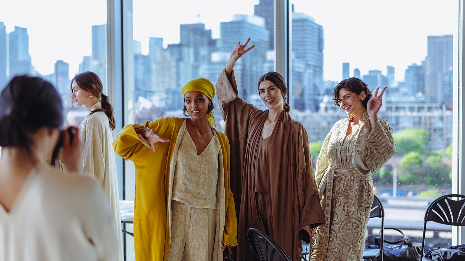 Models wearing Qatari fashion brand LIN pose for the camera.
