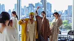 Models wearing Qatari fashion brand LIN pose for the camera.