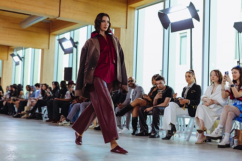 A model wears an outfit designed by Rayan Alami at Fashion Art Toronto on May 29, 2026.
