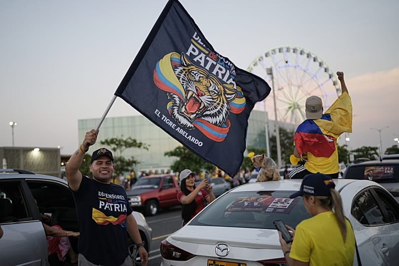 Supporters of presidential candidate Abelardo de la Espriella celebrate after the candidate advanced to a runoff election in Barranquilla, Colombia, Sunday, May 31, 2026.