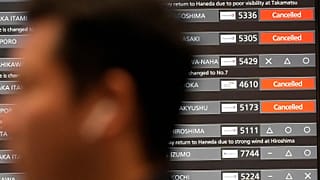 A departing flight information board shows that some flights were canceled due to an approaching Typhoon Shanshan at Haneda airport, 29 August, 2024