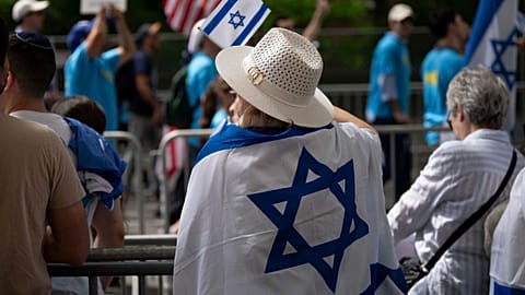 A woman waves an Israeli flag during the Israel Day Parade, Sunday, May 31, 2026, in New York.