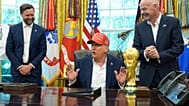 FILE. US President Donald Trump speaks alongside FIFA President Gianni Infantino in the Oval Office, Aug. 2025