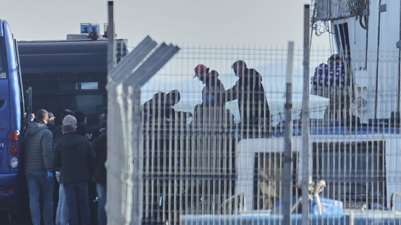 Italian authorities transferring irregular migrants to an Italian-run migration detention center in Shengjin, Albania. This centre is considered as a model for the return hubs