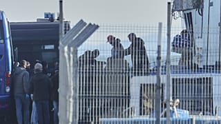 Italian authorities transferring irregular migrants to an Italian-run migration detention center in Shengjin, Albania. This centre is considered as a model for the return hubs