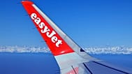 File - The logo of the 'easyJet' airline is seen on a wing of an airplane on a flight from Milan, Italy, to Berlin, Germany, on Monday, 23 February 2026.