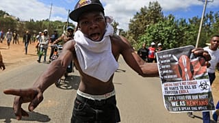 Hundreds of Kenyan youths protest outside the Ebola quarantine center for US citizens