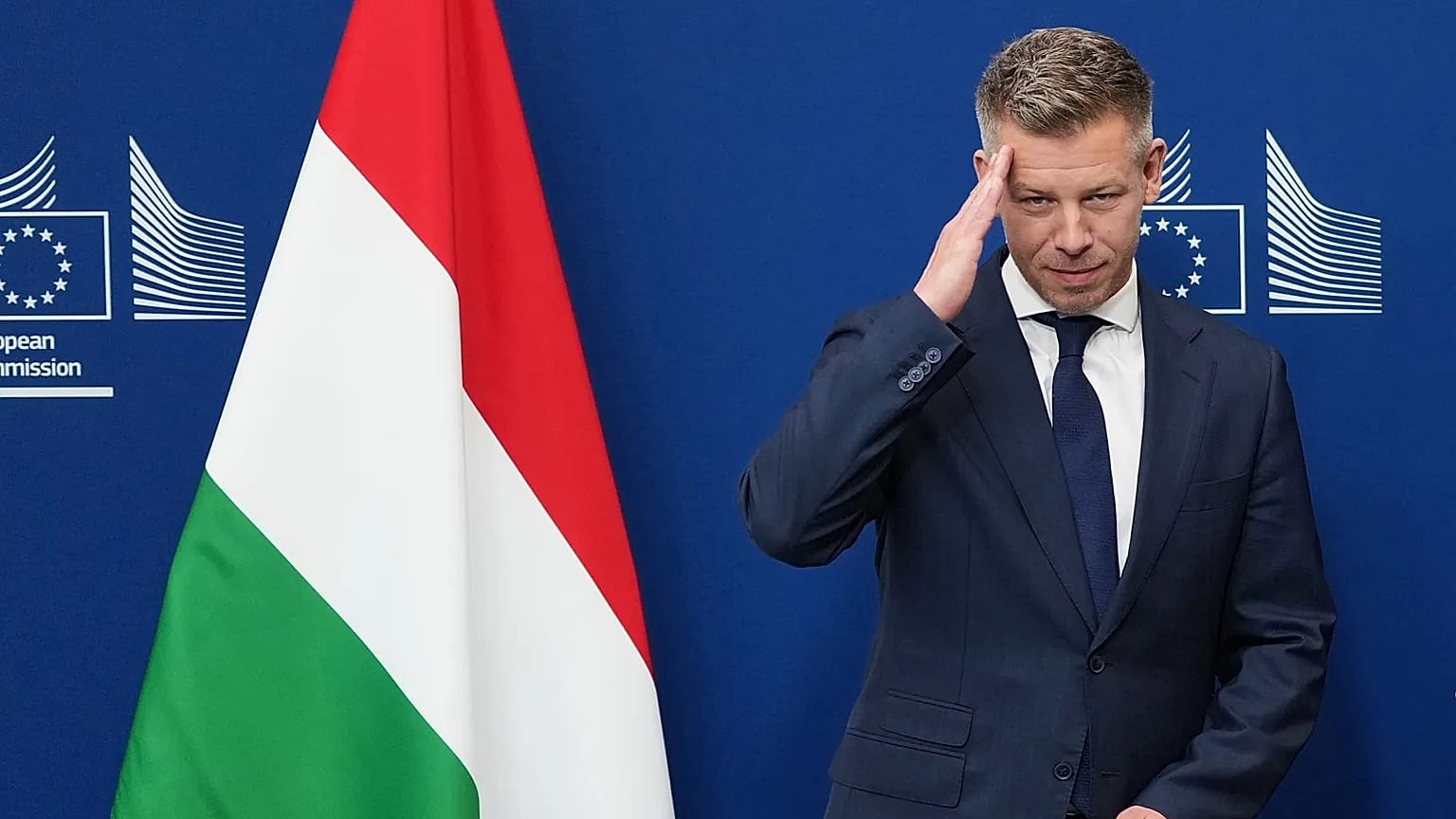 Hungary's Prime Minister Peter Magyar gestures as he is greeted by European Commission President Ursula von der Leyen prior to a meeting at EU headquarters in Brussels, Friday