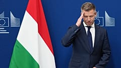 Hungary's Prime Minister Peter Magyar gestures as he is greeted by European Commission President Ursula von der Leyen prior to a meeting at EU headquarters in Brussels, Friday
