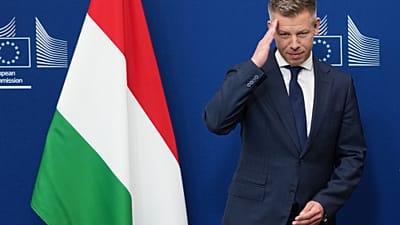 Hungary's Prime Minister Peter Magyar gestures as he is greeted by European Commission President Ursula von der Leyen prior to a meeting at EU headquarters in Brussels, Friday