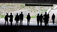 Migrant pupils walk under a railway bridge in Flen, 30 August, 2018