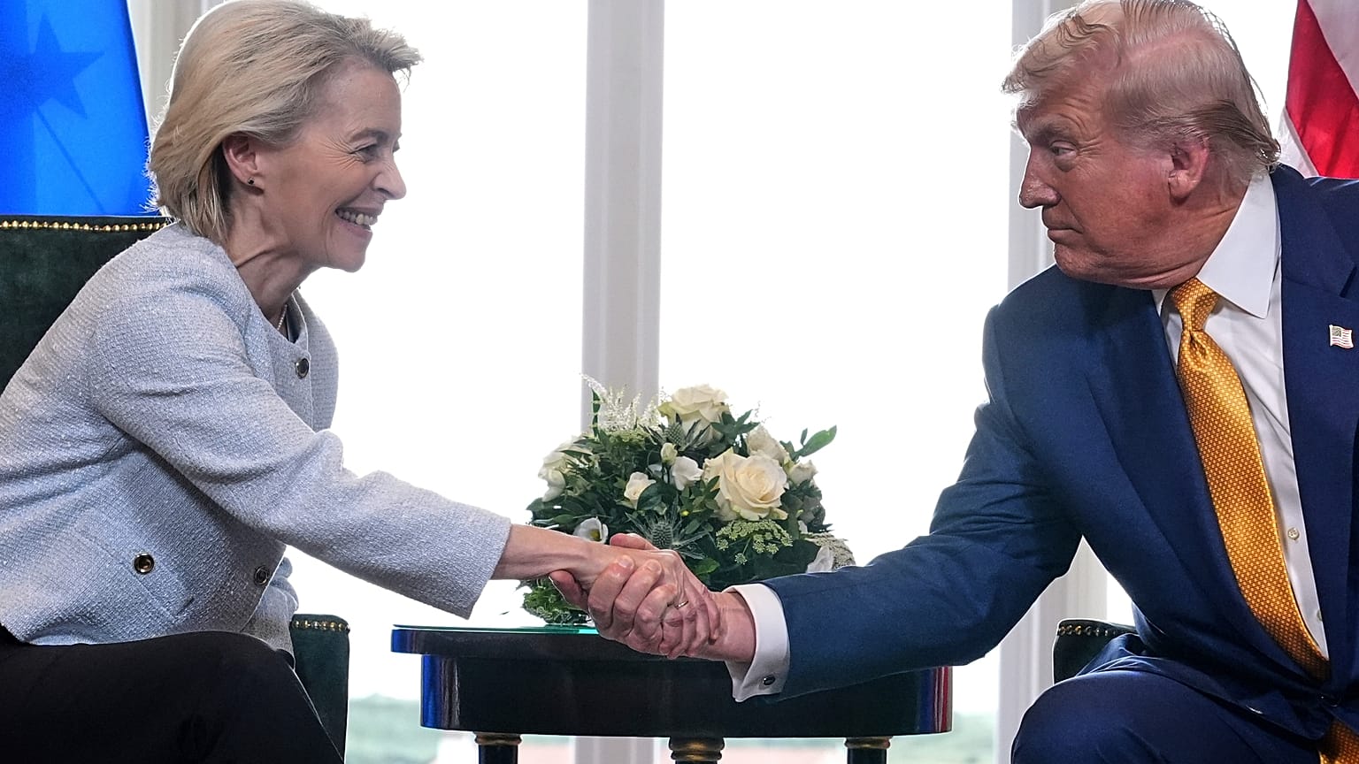 President Donald Trump and European Commission President Ursula von der Leyen shake hands after reaching a trade deal at the Trump Turnberry golf course in Turnberry, Scotland