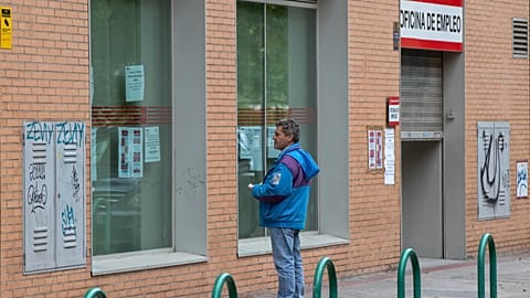 A man standing outside a job centre