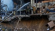 A rescue worker puts out a fire of a building damaged after a Russian strike on Kyiv, 2 June, 2026