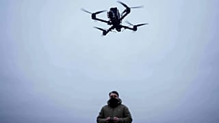 A serviceman controls an FPV drone of "General Cherry" company at the polygon in Ukraine, on Dec. 4, 2025