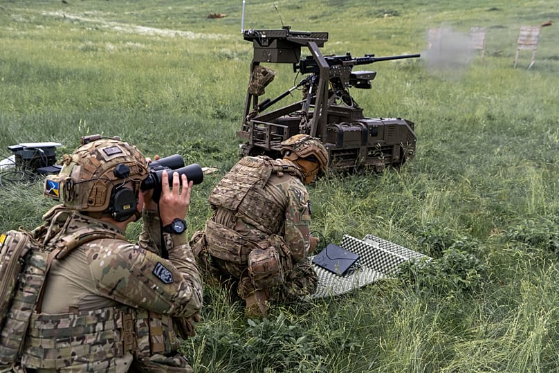 Ukrainian servicemen of the Cerberus Ground Unmanned Systems, Third Army Corps, conduct a drill with a combat ground drone in Kharkiv region, Ukraine,  May 24, 2026.
