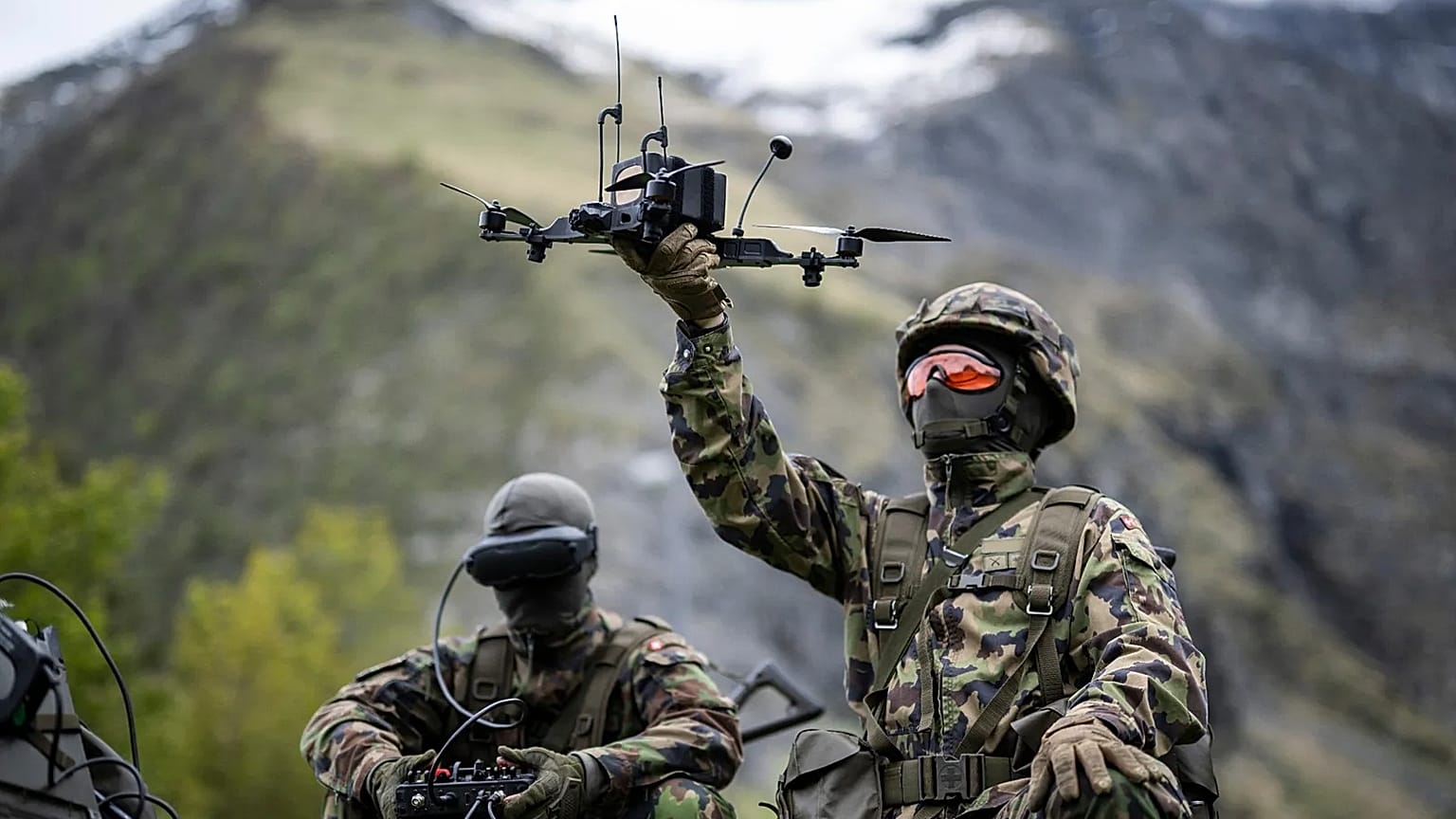 A soldier poses with a drone during a press event of the Swiss Army in Elm, Switzerland, 18 May, 2026. 