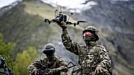 A soldier poses with a drone during a press event of the Swiss Army in Elm, Switzerland, 18 May, 2026. 